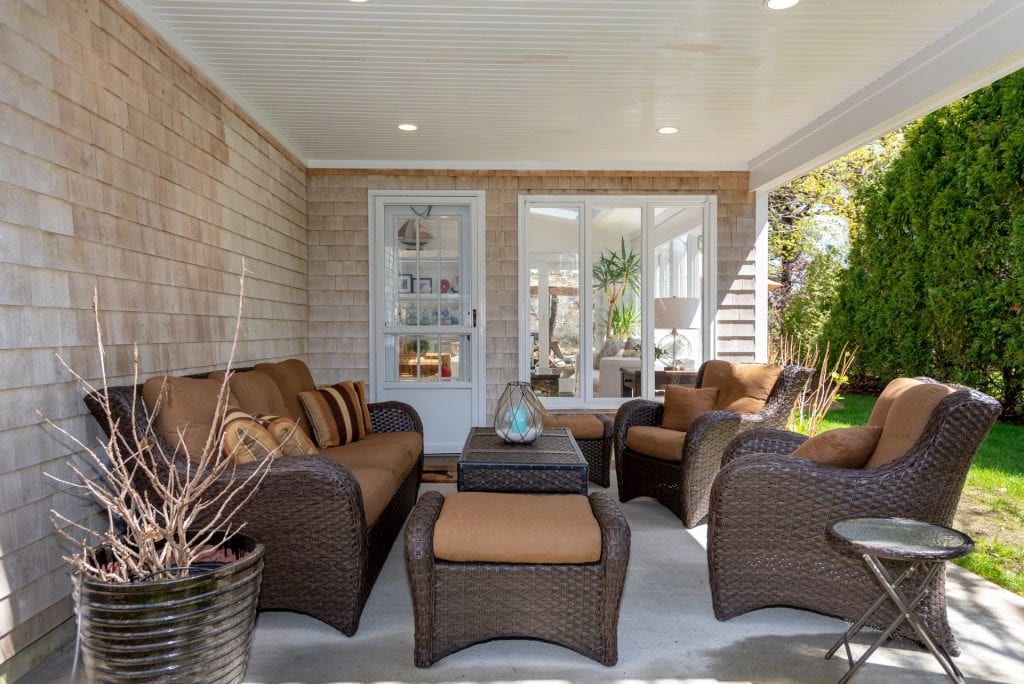 Covered Porch Features Outdoor Living Room 63 Herring Creek Road Edgartown MA 02539 Martha's Vineyard Katama Farmhouse With Standout Style